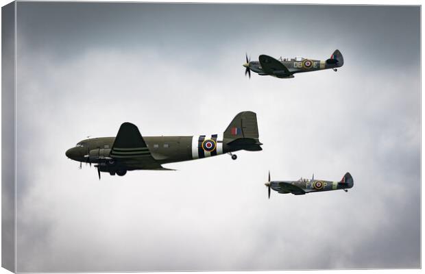 Dakota and Spitfires Canvas Print by J Biggadike