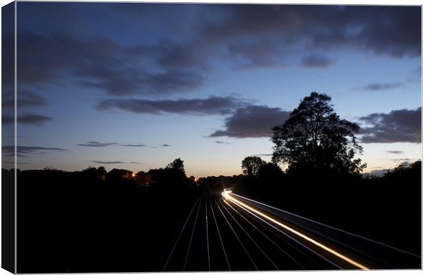 Passing Train Canvas Print by J Biggadike