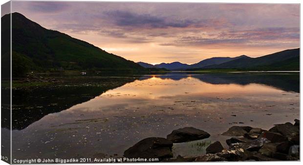 Loch Leven as the sun sets Canvas Print by John Biggadike