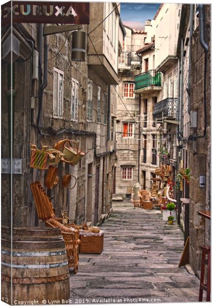 Basket Sellers of Vigo Canvas Print by Lynn Bolt