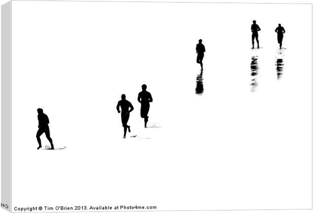 People Running On White Beach Canvas Print by Tim O'Brien