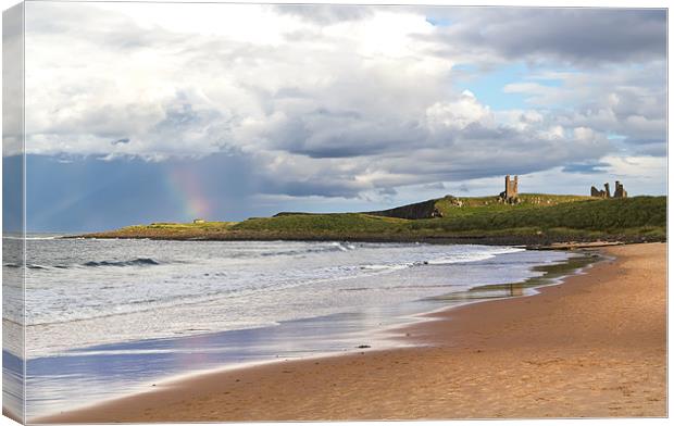 Rainbow at Dunstanburgh Castle Canvas Print by Kevin Tate