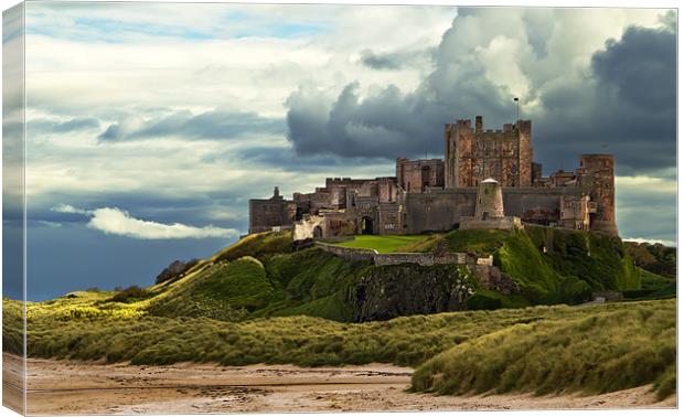 Cloudy Bamburgh Castle Canvas Print by Kevin Tate