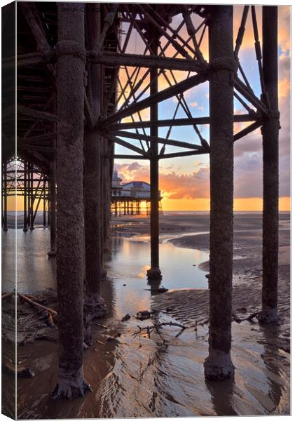 Under The Pier Sunset. Canvas Print by Jason Connolly