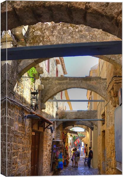 An alley in Rhodes Town Canvas Print by Tom Gomez