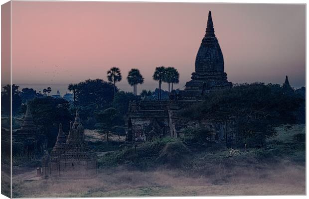 Mysterious Stupas In Bagan At Dawn Canvas Print by Chris Lord