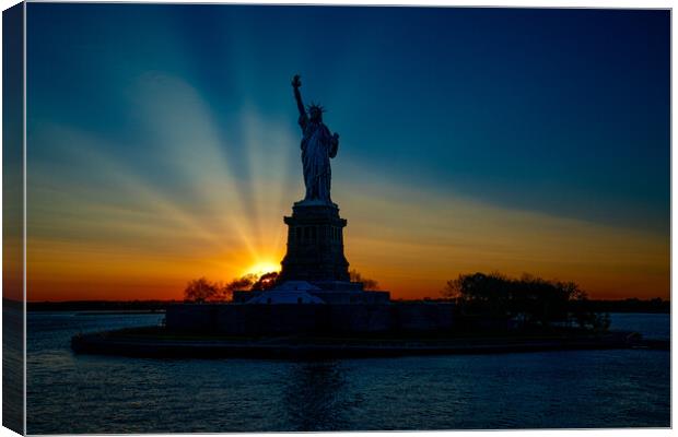 Sunset At The Statue Of Liberty Canvas Print by Chris Lord