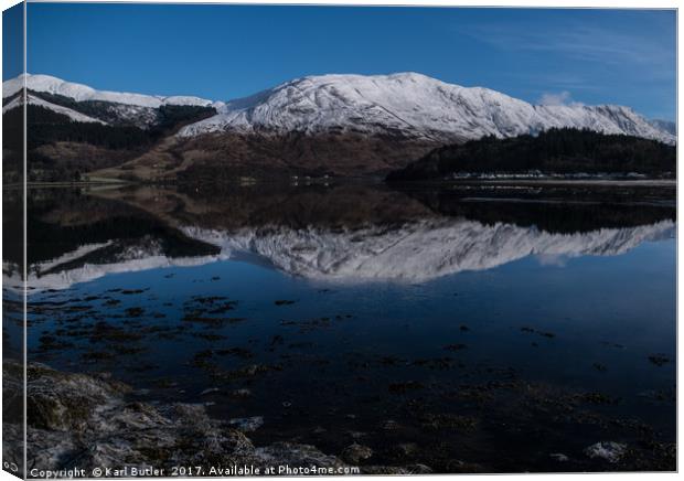 Reflections of Loch Leven and the mountains Canvas Print by Karl Butler
