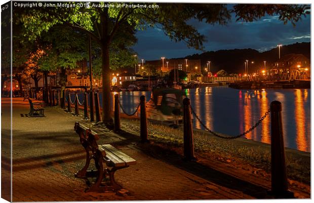  The bench on the docks. Canvas Print by John Morgan