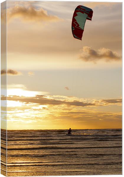 Kitesurfing to the Sun Canvas Print by Roger Green