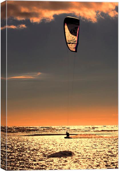 Kitesurfing at Sunset Canvas Print by Roger Green