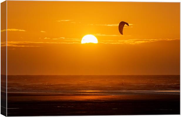 Kitesurfing at Sunset Canvas Print by Roger Green