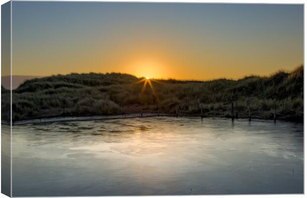 Frozen Pond in the Ainsdale Sand Dunes Canvas Print by Roger Green