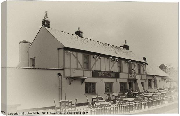 The Talbot Pub,Keynsham, in the Snow. Canvas Print by John Miller