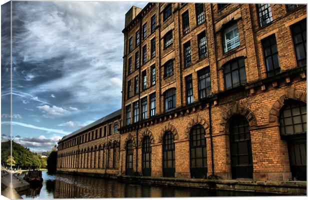 part of  salts mill over  leeds liverpool canal Canvas Print by simon sugden