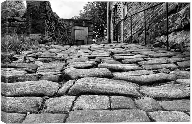 cobbled street in Heptonstall Canvas Print by simon sugden
