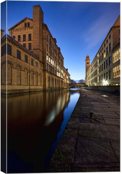 salts mill on leeds liverpool canal late winters e Canvas Print by simon sugden