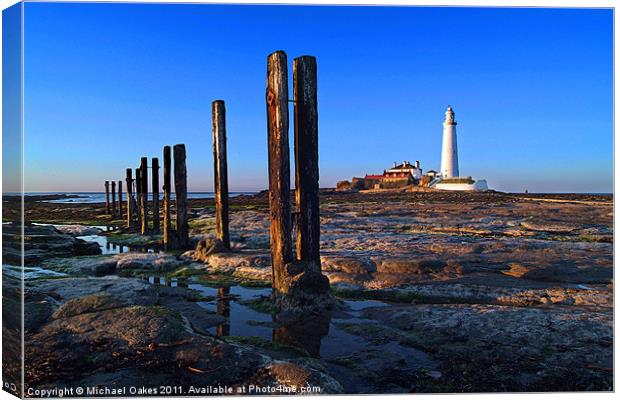 St. Mary's Lighthouse, sunset. Canvas Print by Michael Oakes