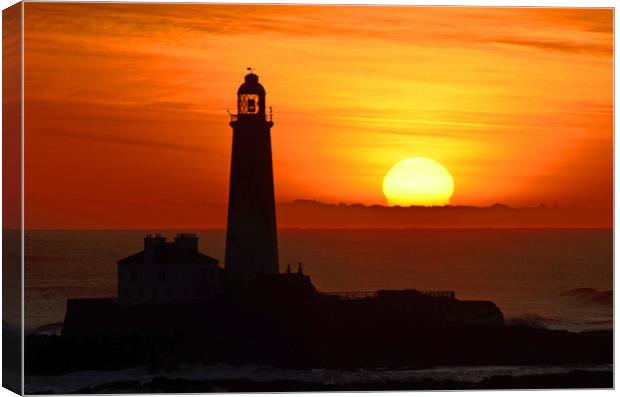       St Mary's Lighthouse, winter sunrise.        Canvas Print by Michael Oakes