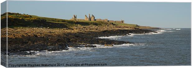 Dunstanburgh castle and coast aspect Canvas Print by Stephen Wakefield