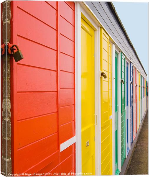 Colourful Beach Huts Canvas Print by Nigel Bangert