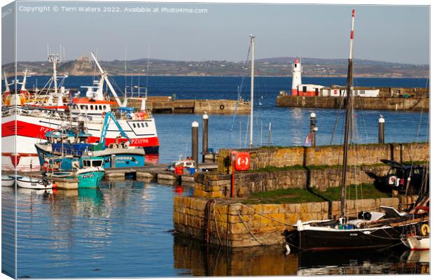 Newlyn South Pier Lighthouse and St Michael's Mount Canvas Print by Terri Waters