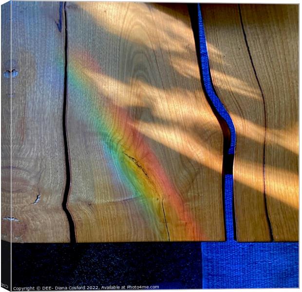 Prism patterns alight on natural wood table Canvas Print by DEE- Diana Cosford