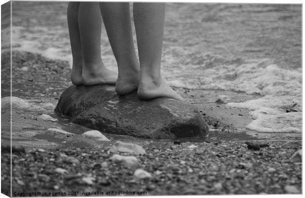standing on a pebble beach Canvas Print by jo egerton