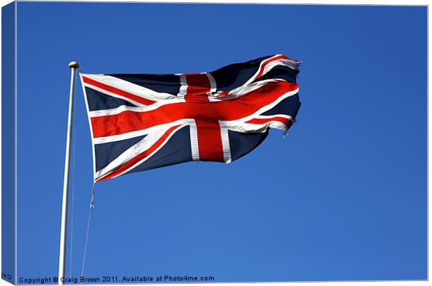 Union Jack on blue sky Canvas Print by Craig Brown