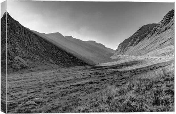 Afternoon sun rays in Bealach na Ba black and whit Canvas Print by Gary Eason