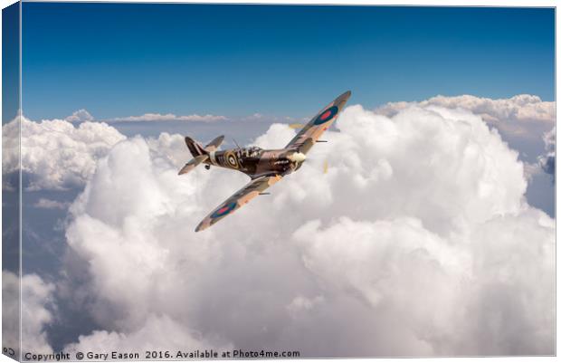 Spitfire above clouds Canvas Print by Gary Eason