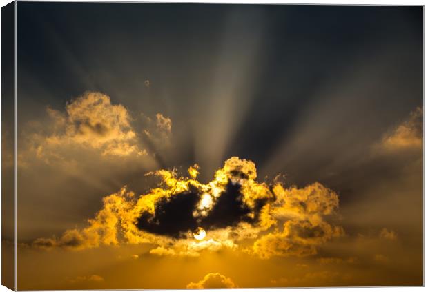 The Sun and Clouds Canvas Print by Hassan Najmy