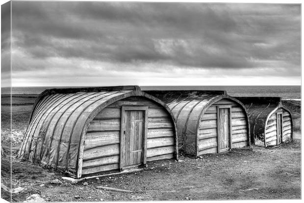 Lindisfarne Boat Huts Canvas Print by Neil Young