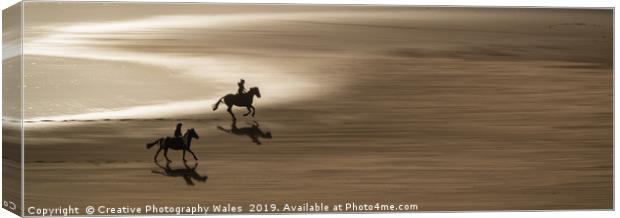 Ponies on the beach at Three Cliffs Bay, Gower Pen Canvas Print by Creative Photography Wales
