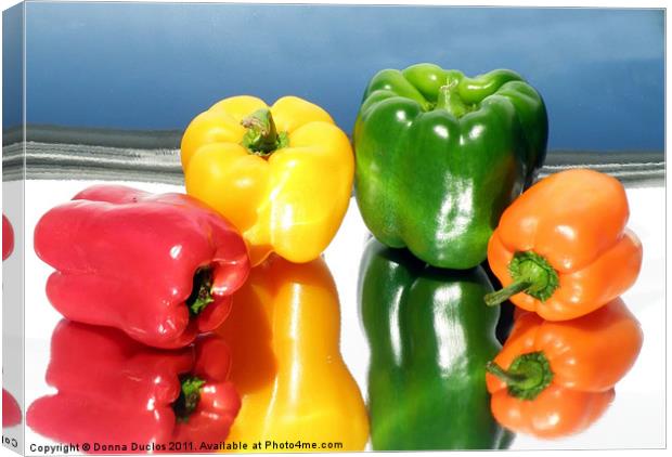 Colorful Peppers Canvas Print by Donna Duclos