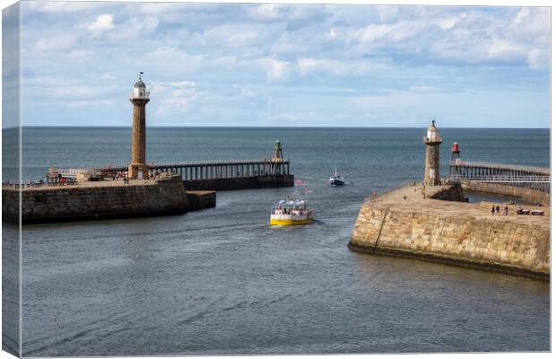 Whitby Harbour East and West Piers Canvas Print by Derek Beattie