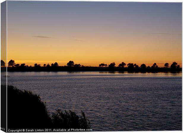 Sunset across a lake Canvas Print by Sarah Osterman