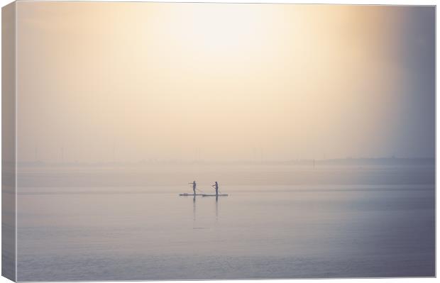 Paddle boarder at West Mersea Canvas Print by Mark Harrop