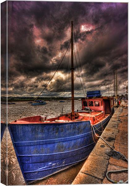 Old Boat in a storm Canvas Print by Dean Messenger