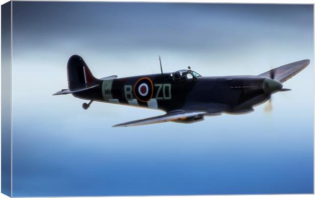 Spitfire in Flight Canvas Print by Dean Messenger