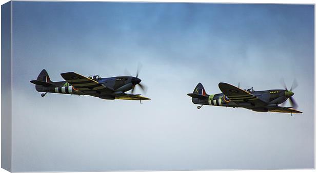 Spitfires in Flight Canvas Print by Dean Messenger