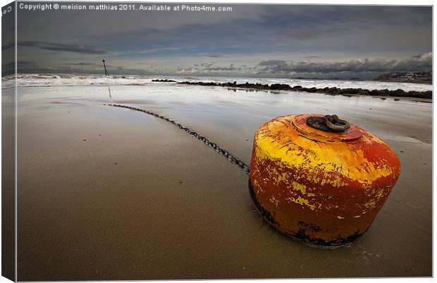 beached mooring buoy Canvas Print by meirion matthias