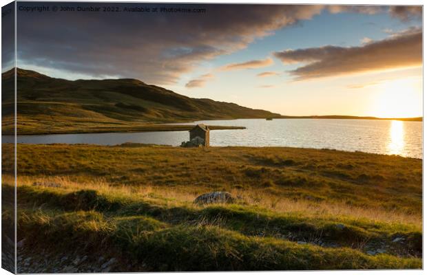 Setting sun over Devoke Water Canvas Print by John Dunbar