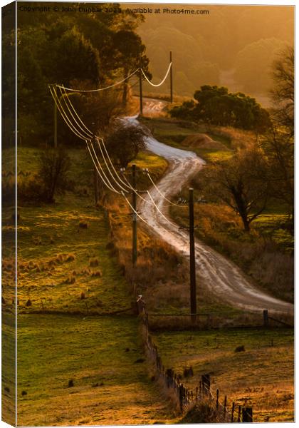 Sunset on Dowdells Road Canvas Print by John Dunbar