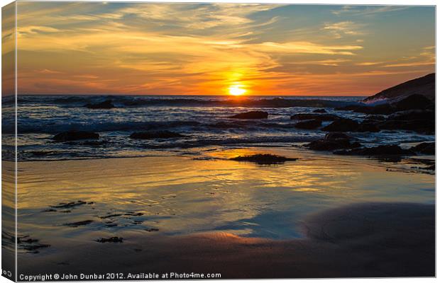 Sunset on Whipsiderry Beach Canvas Print by John Dunbar