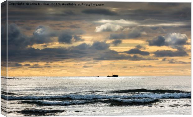 Beadnell Bay Canvas Print by John Dunbar