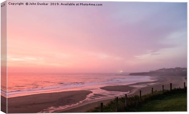 Dawn On Tynemouth Beach Canvas Print by John Dunbar