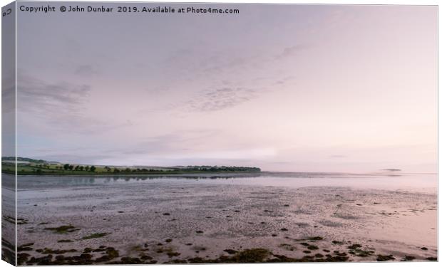 Low Tide at Budle Bay Canvas Print by John Dunbar