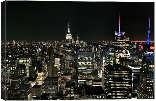 Manhattan At Night Canvas Print by Phil Clements