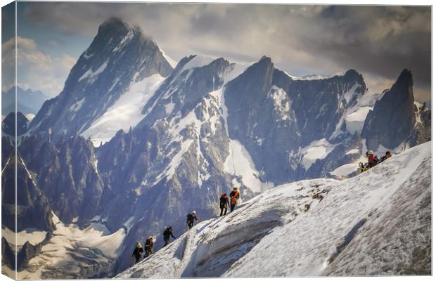 Climbers on the edge Canvas Print by Julian Bowdidge